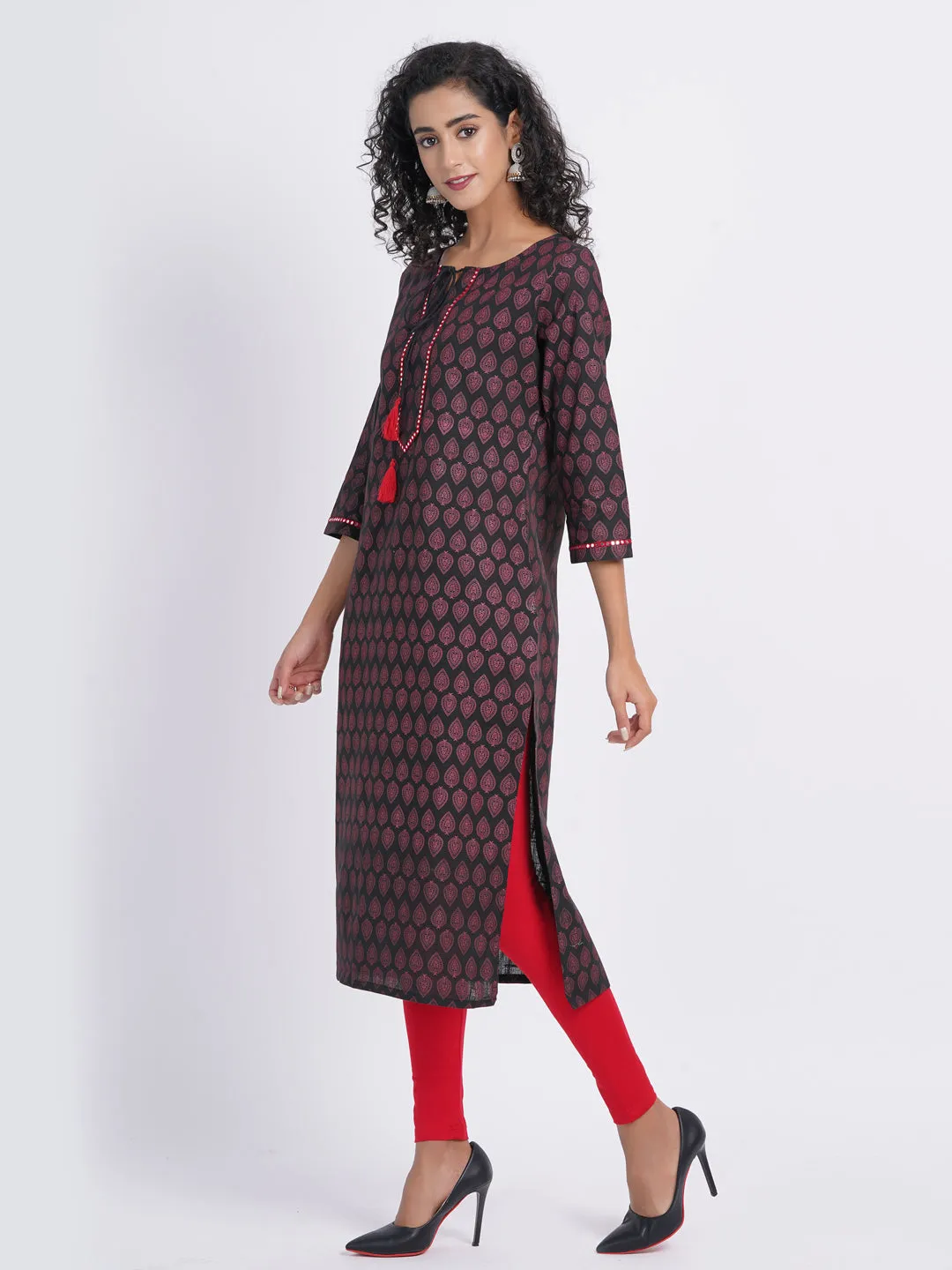 CASUAL WORK WEAR IN OUR CONTRAST PRINTED WITH MIRROR WORK EMBROIDERY STRAIGHT KURTI DETAILED WITH DORI TESSEL.